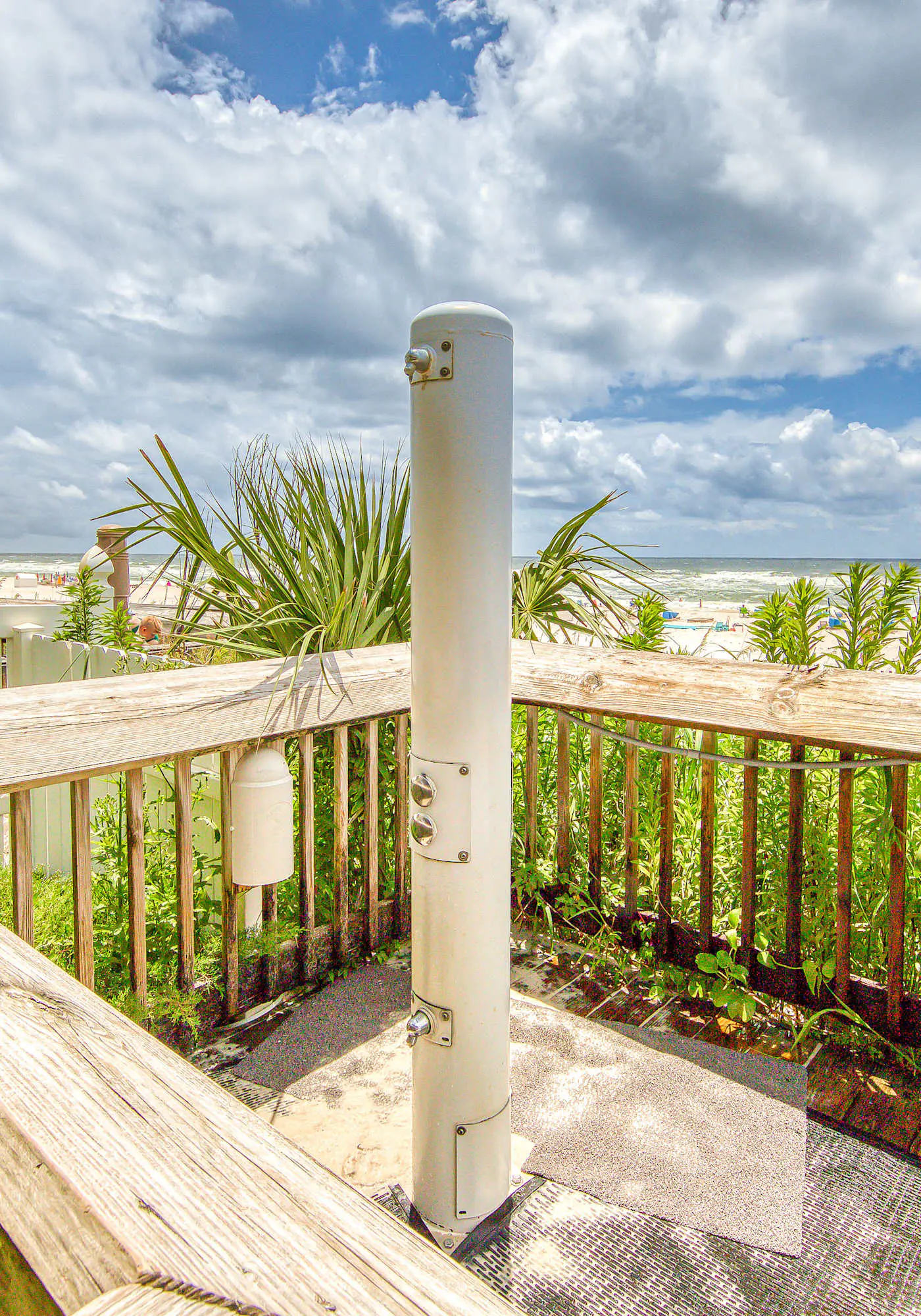 Gulf-view condo with central AC, WiFi, laundry, pools, gym & tennis
