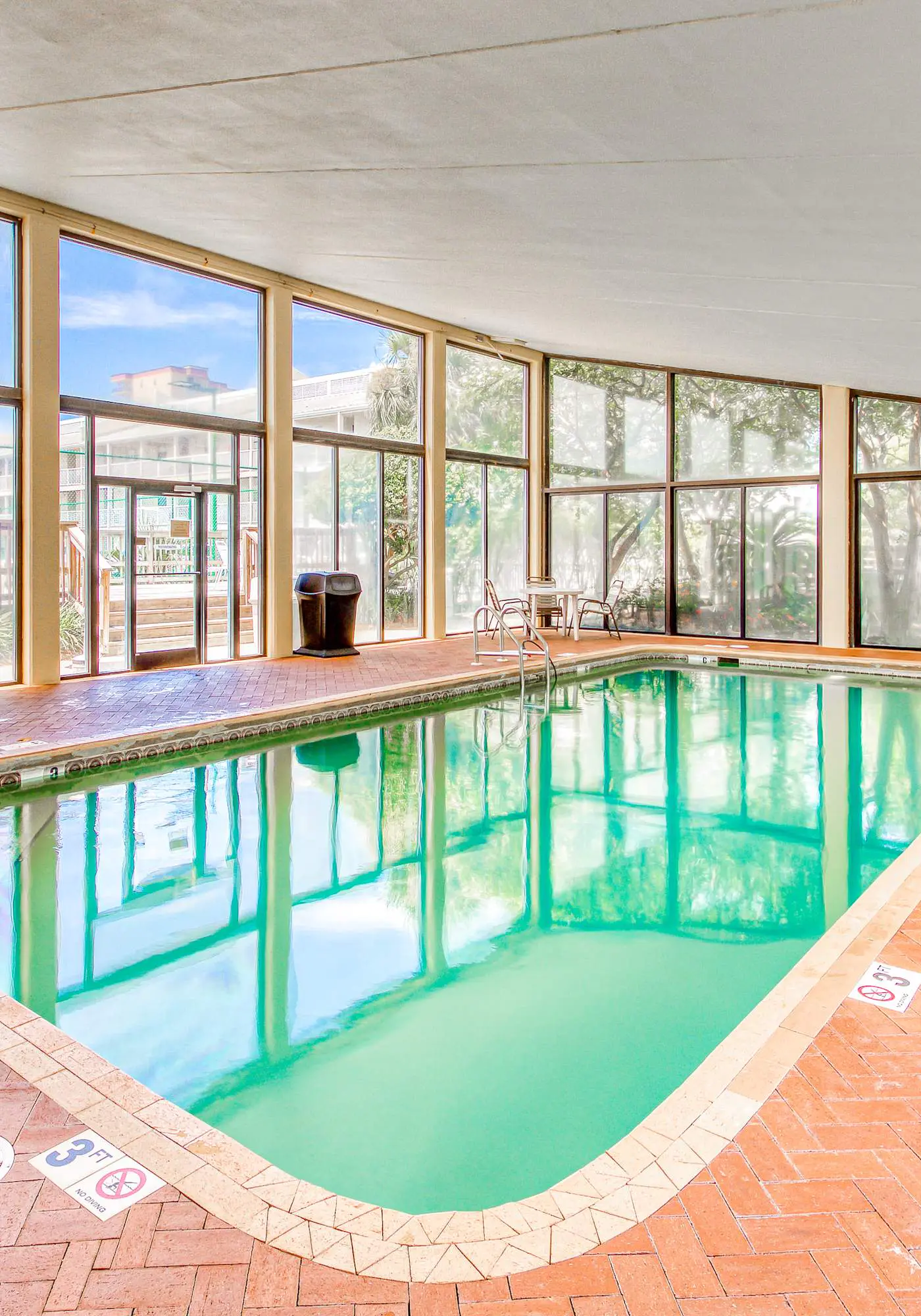 Gulf-view condo with central AC, WiFi, laundry, pools, gym & tennis