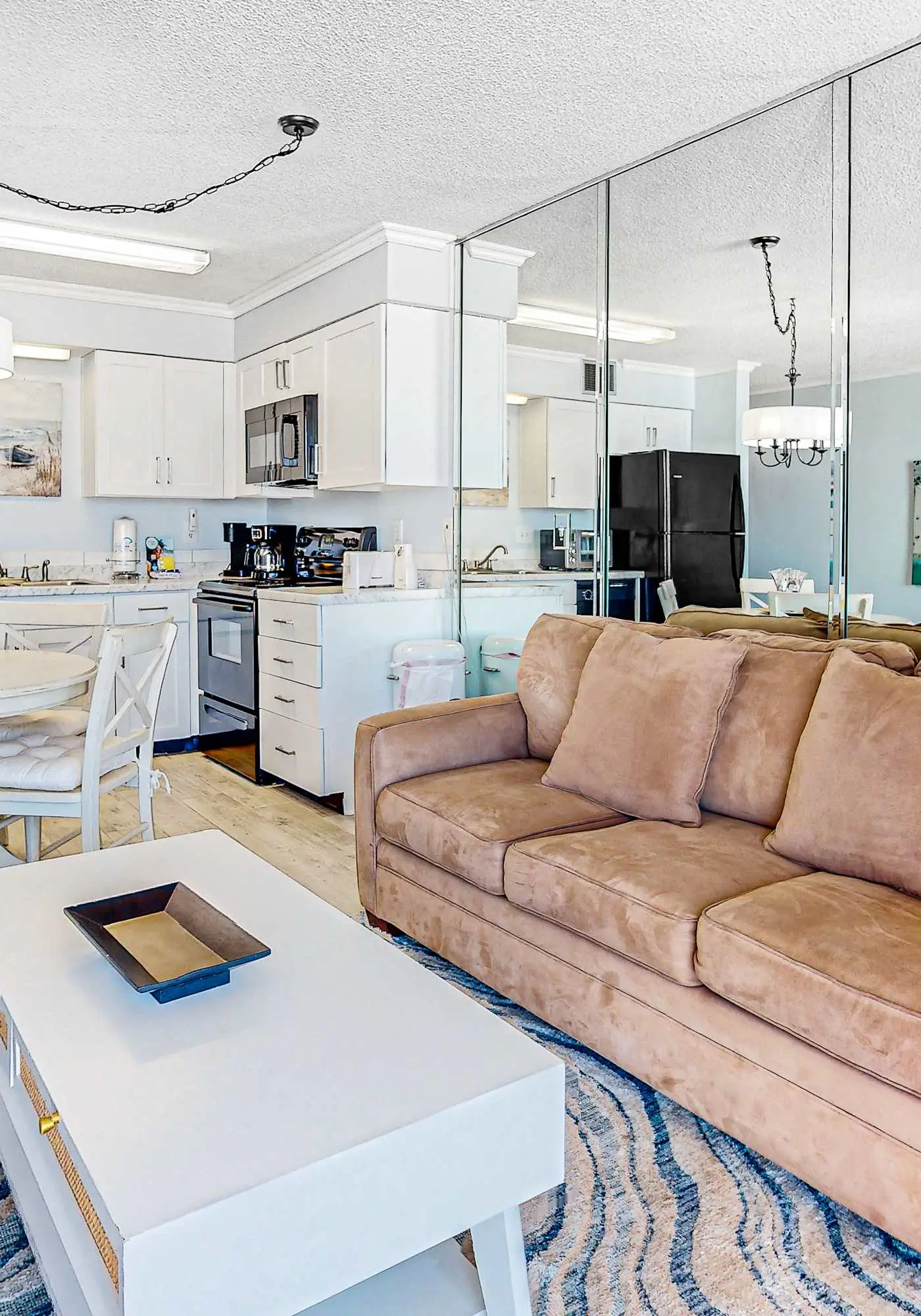 Gulf-view condo with central AC, WiFi, laundry, pools, gym & tennis