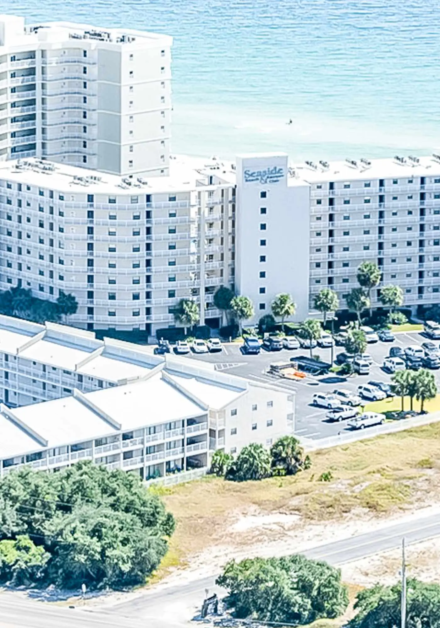 Gulf-view condo with central AC, WiFi, laundry, pools, gym & tennis