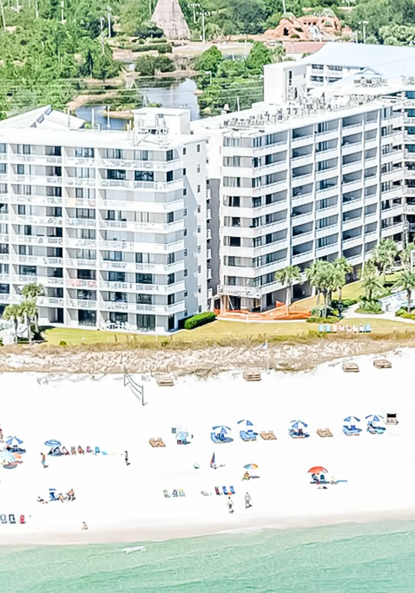 Gulf-view condo with central AC, WiFi, laundry, pools, gym & tennis