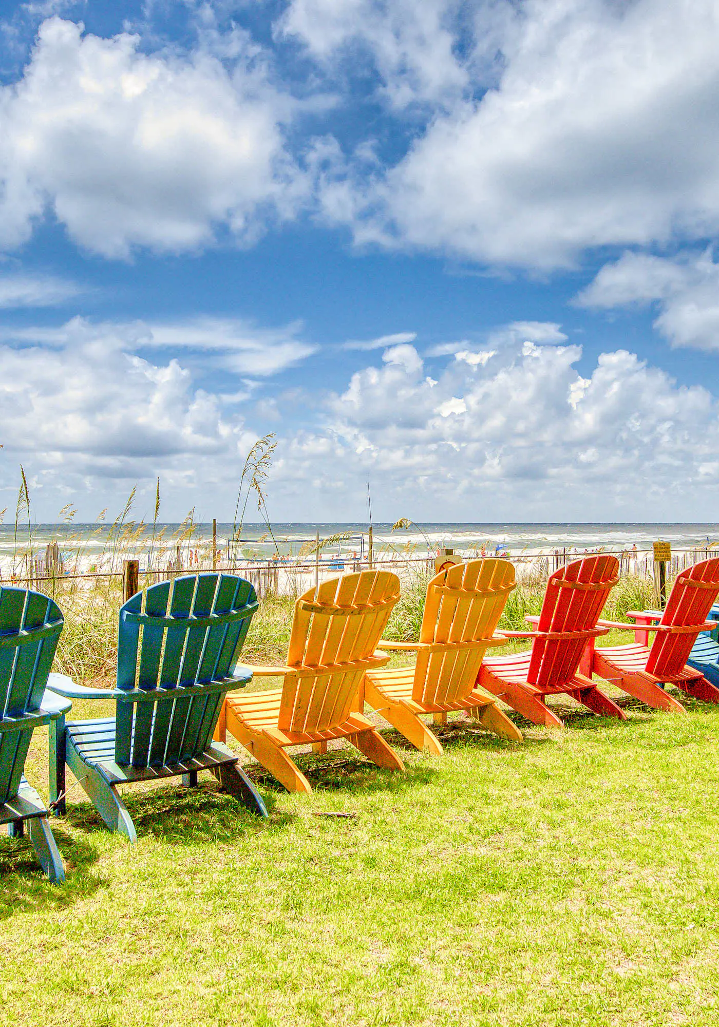 Gulf-view condo with central AC, WiFi, laundry, pools, gym & tennis
