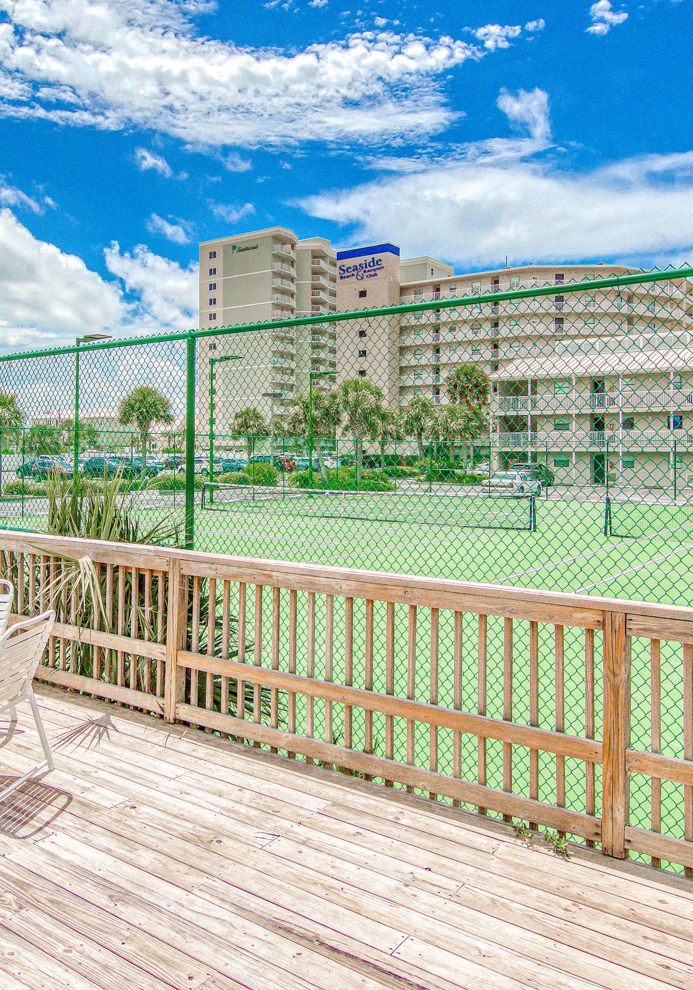 Gulf-view condo with central AC, WiFi, laundry, pools, gym & tennis