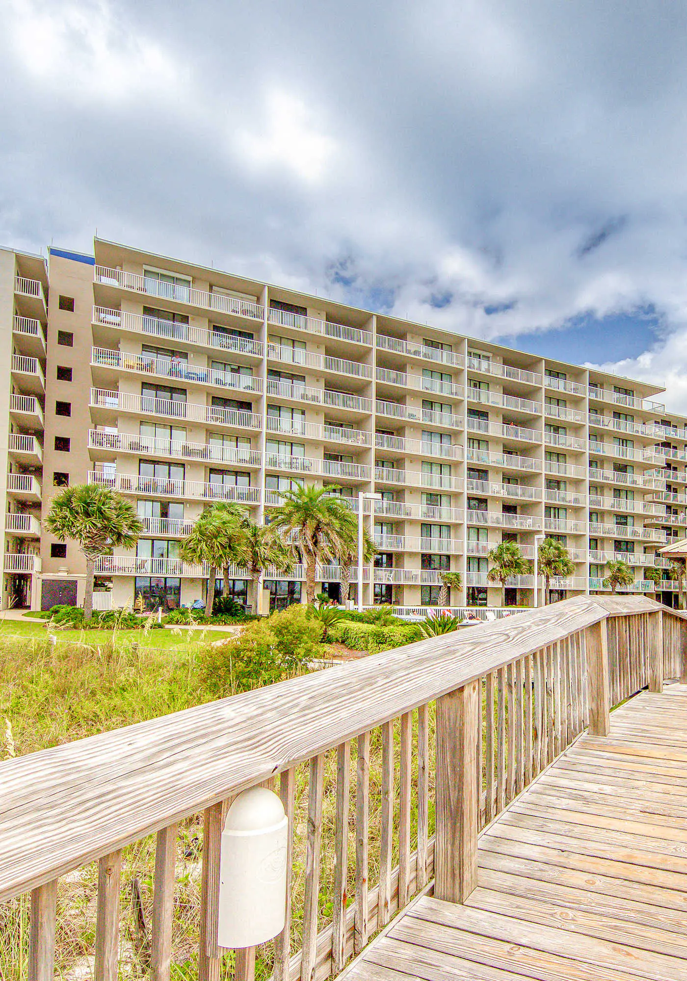Gulf-view condo with central AC, WiFi, laundry, pools, gym & tennis