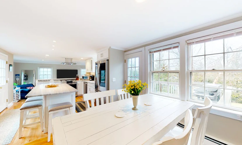 Sunny, Cape-style home with a game room, yard, firepit, & washer/dryer