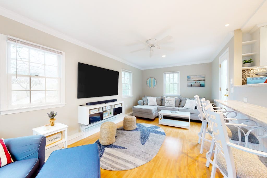 Sunny, Cape-style home with a game room, yard, firepit, & washer/dryer