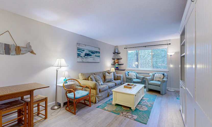Cozy condo with golf course view, balcony, W/D, AC, & games