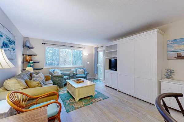Cozy condo with golf course view, balcony, W/D, AC, & games