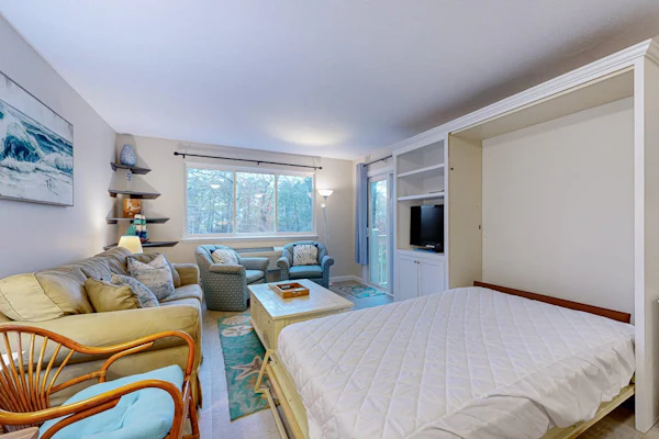 Cozy condo with golf course view, balcony, W/D, AC, & games