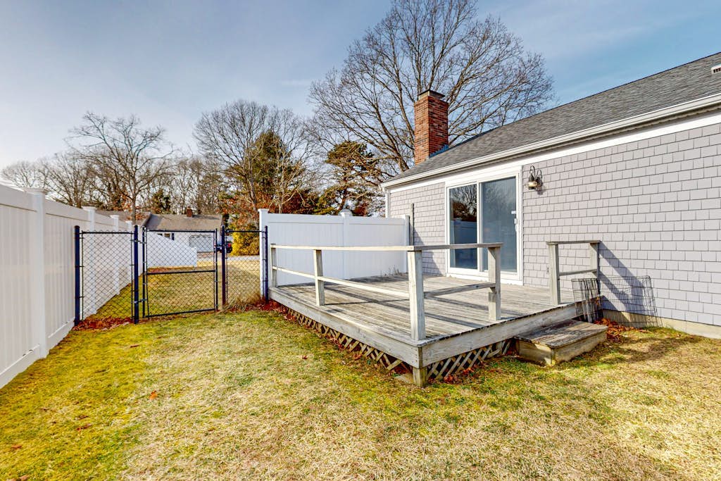 Single-story home with fenced yard, deck & great location near town/beaches