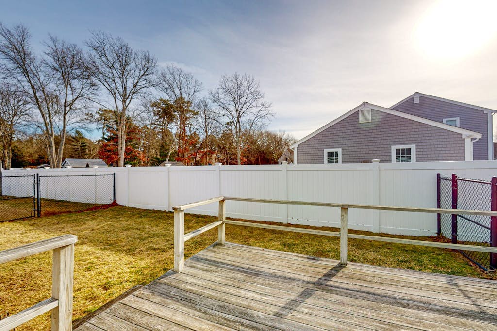 Single-story home with fenced yard, deck & great location near town/beaches