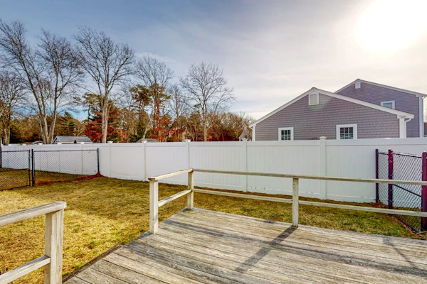 Single-story home with fenced yard, deck & great location near town/beaches
