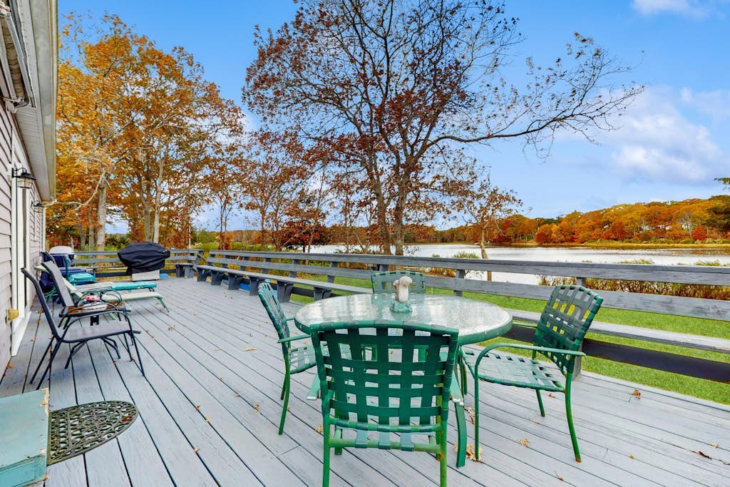 Waterfront Cape house with large deck, fireplace, modern kitchen & grassy yard