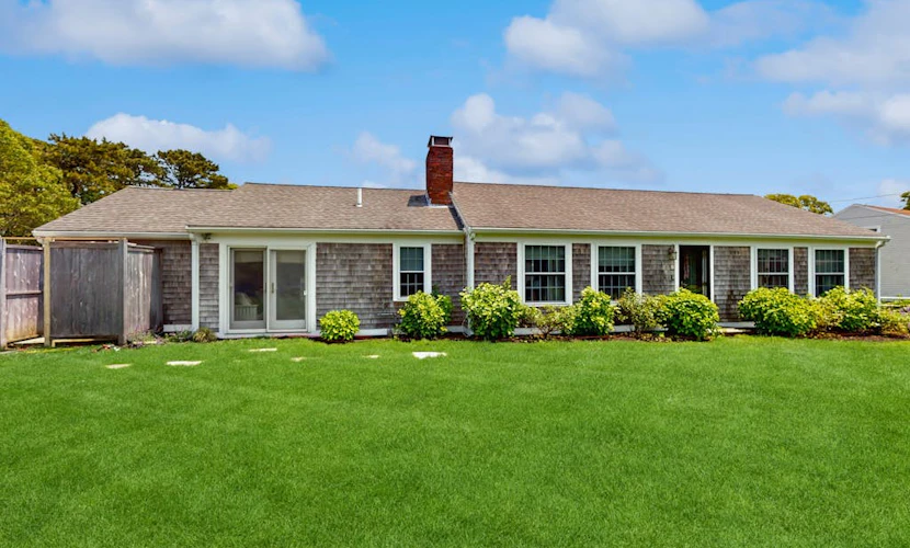 Home near beach & tennis/basketball court with firepit, grill, & patio