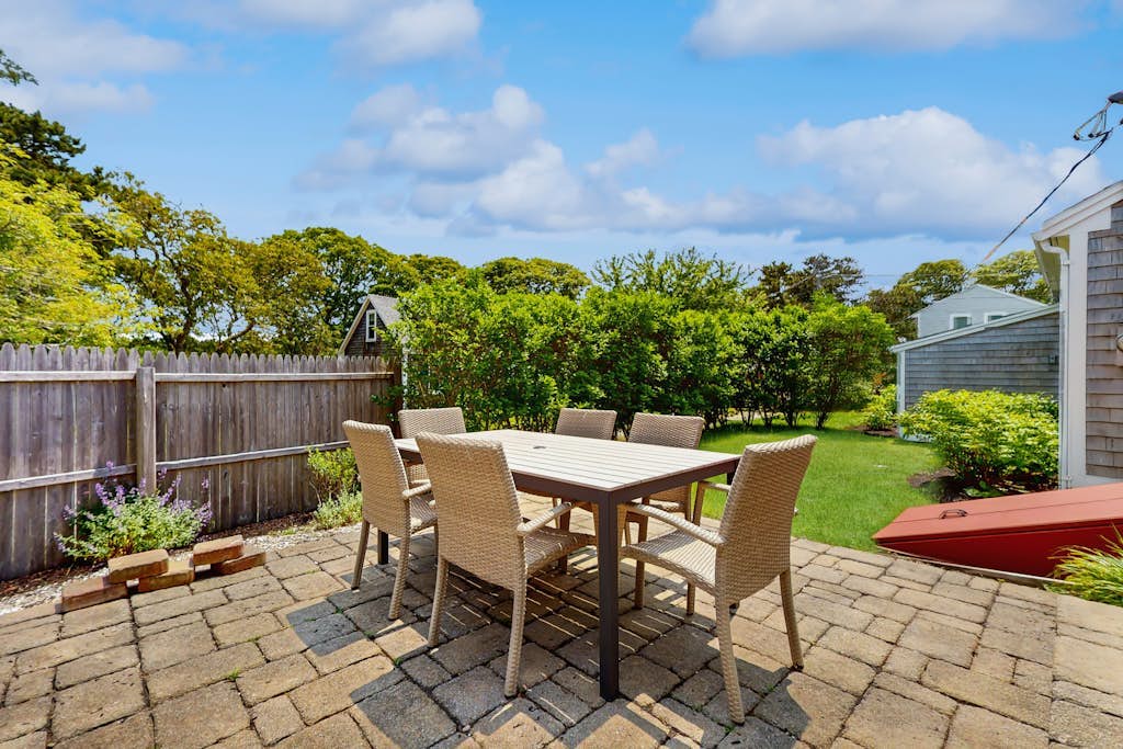 Home near beach & tennis/basketball court with firepit, grill, & patio