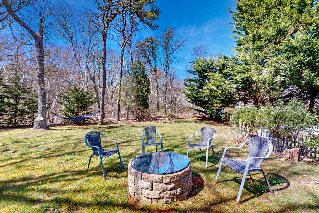 Water-view house near golf with firepit, grill, deck, central AC & washer/dryer