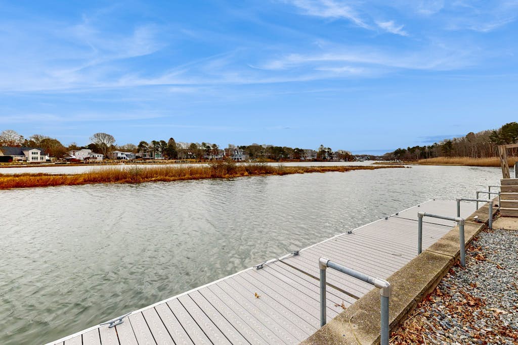 Waterfront home with firepit, grill, open layout, smart TVs, deck, W/D, & AC