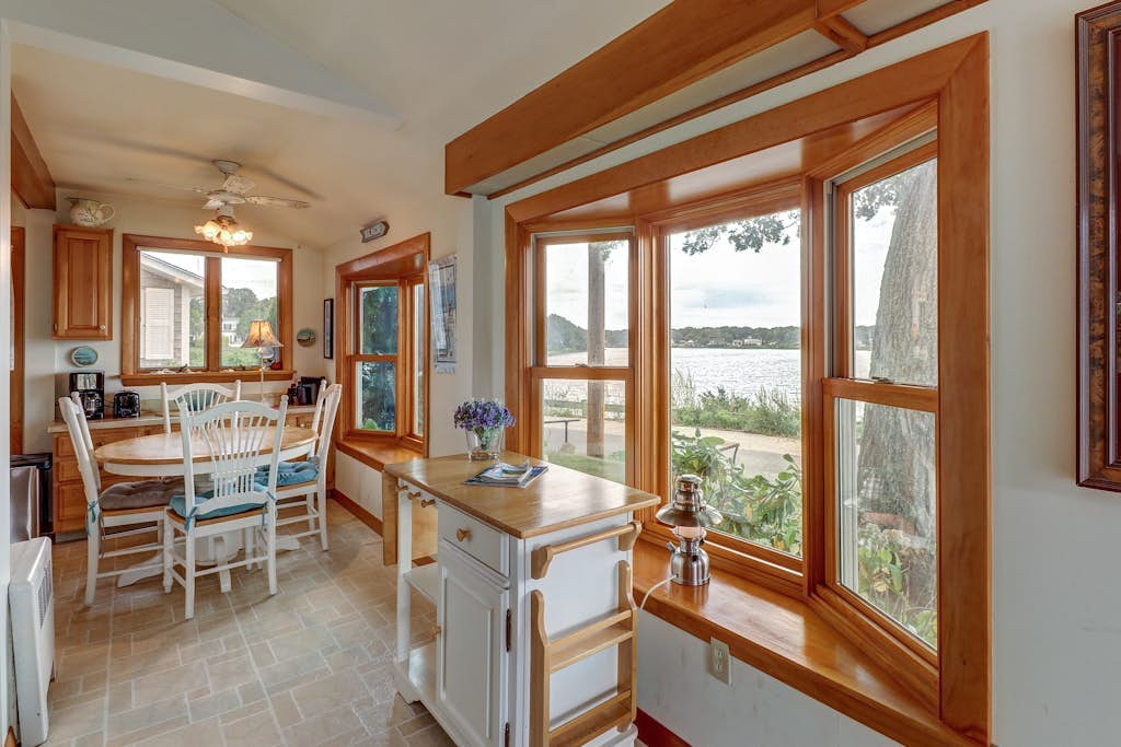 Lakefront home with beach views, WiFi, gas grill & patio - near beach