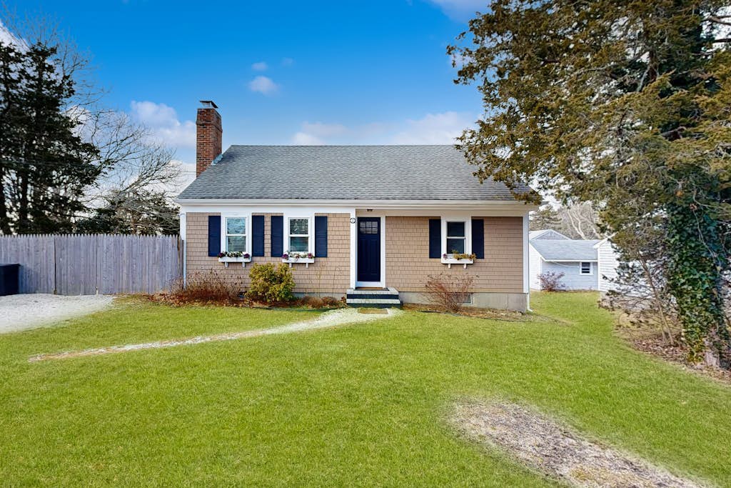 Two-story dog-friendly retreat with enclosed yard, playset, W/D, & firepit