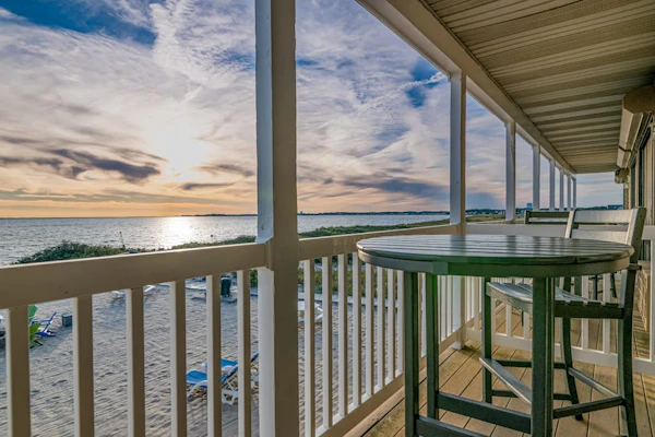 Oceanfront escape with full kitchen, bay-view balcony, AC & firepit