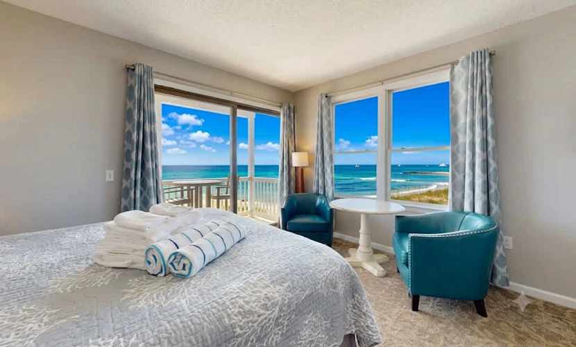 Oceanfront oasis with beautiful bay-view balcony, AC, firepit & grills