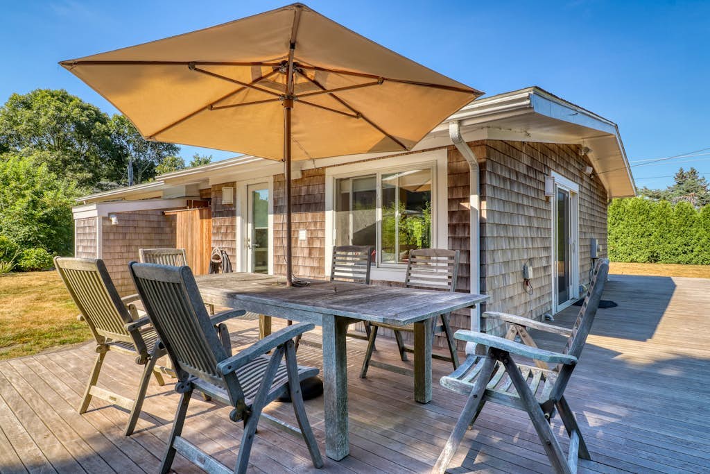 Coastal home with outdoor shower, grill, fireplace, central AC, & W/D