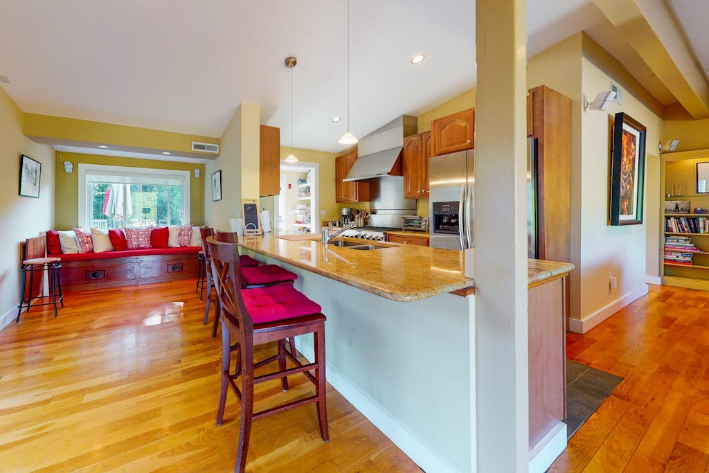 Coastal home with outdoor shower, grill, fireplace, central AC, & W/D