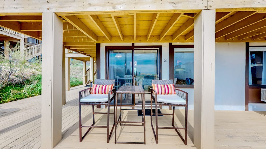 Ocean-view studio near golf with patio, beach gear, kitchenette, & partial AC