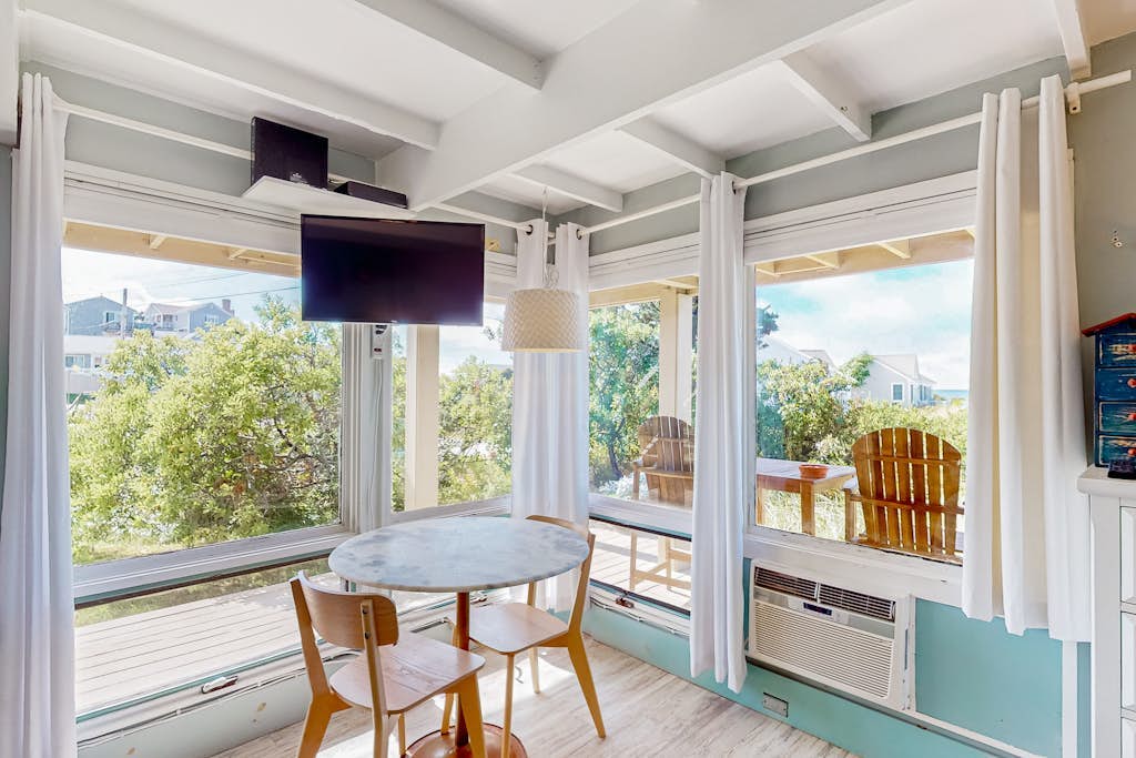 Charming coastal studio with private beach access, scenic patio, grill, & games