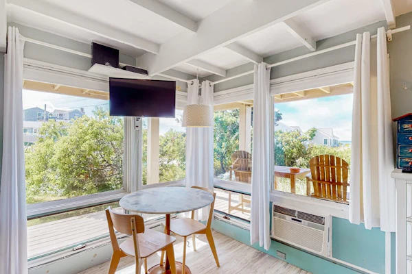 Charming coastal studio with private beach access, scenic patio, grill, & games