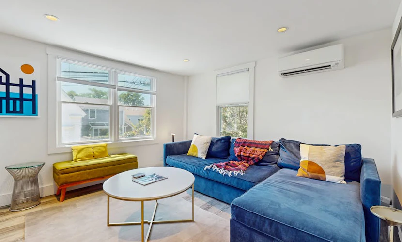 Second-floor condo steps from downtown with large deck, partial bay view & AC