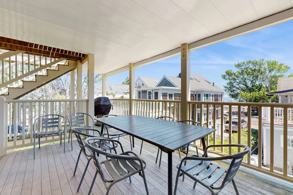 Second-floor condo steps from downtown with large deck, partial bay view & AC