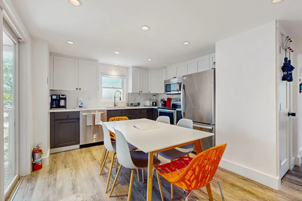 Second-floor condo steps from downtown with large deck, partial bay view & AC