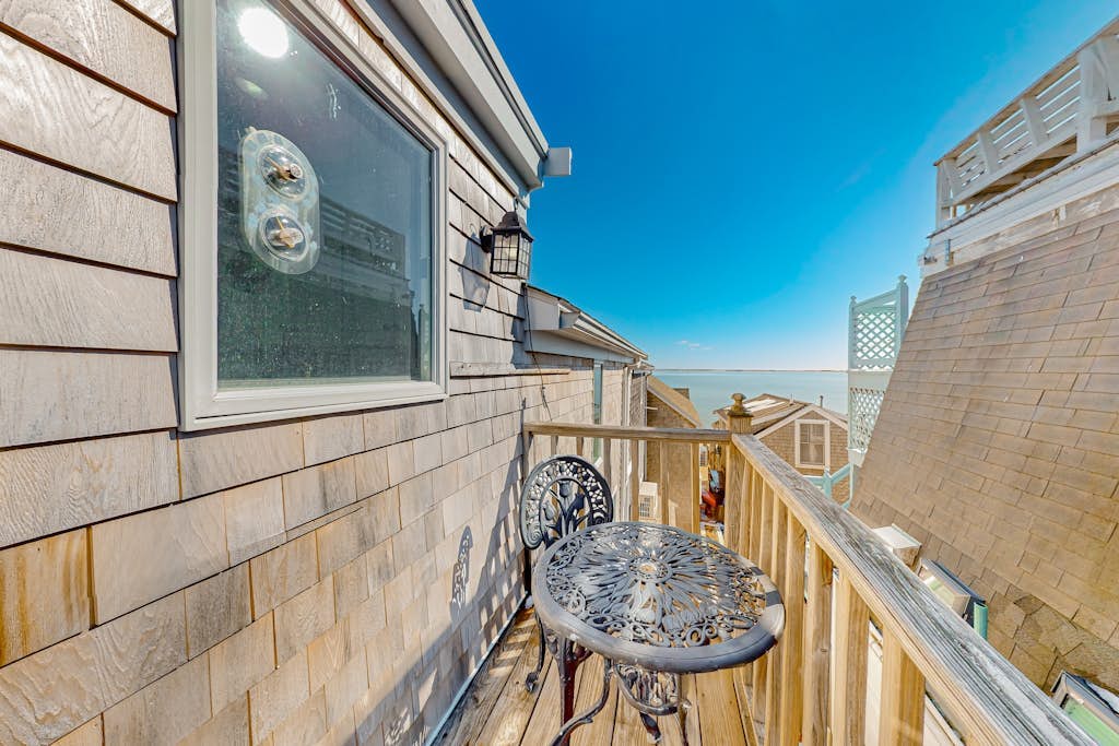 Two-story condo with ocean views, unique setup, parking, & private balcony