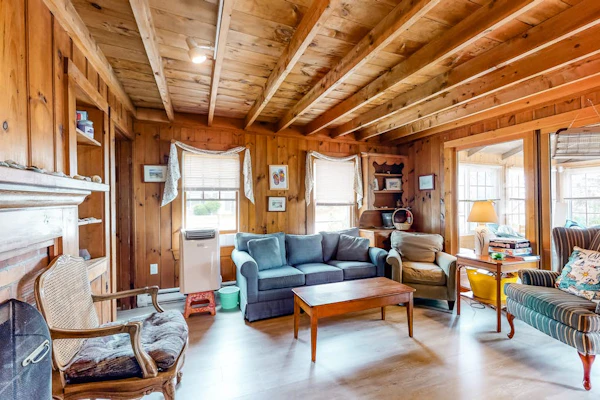 Two-story home with beach access, sunroom, fast WiFi, washer/dryer, & partial AC