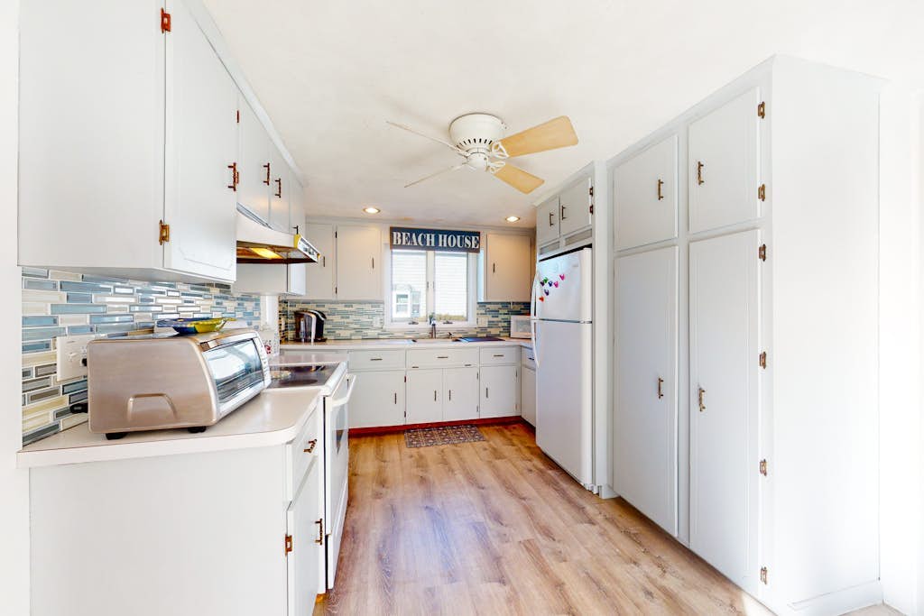 Dog-friendly coastal home steps from beach with grill, firepit, & washer/dryer