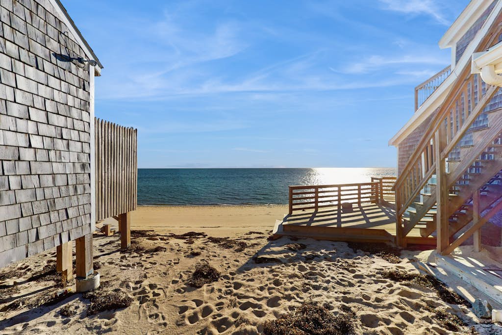 Cozy coastal condo steps from the beach with private deck & two parking spots