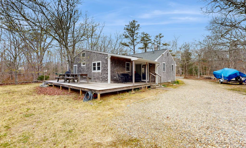 Quaint home across from bike paths with large furnished deck, grill, & W/D