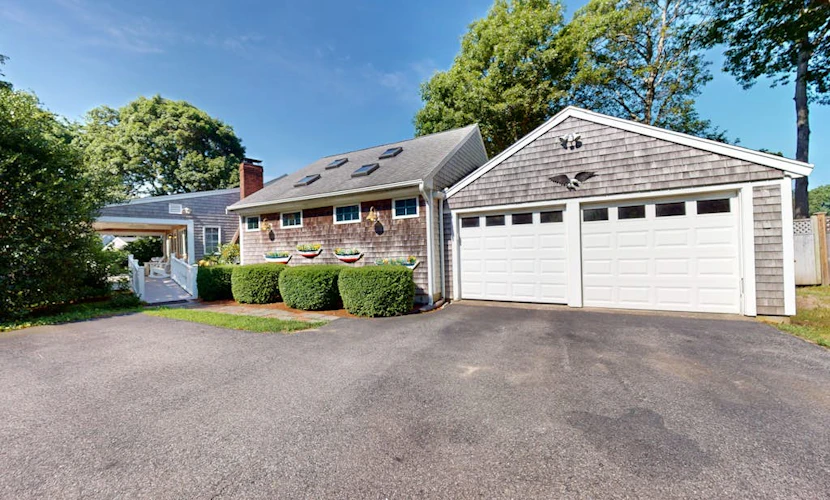 Tree-lined home with lovely yard, decks & private beach access - walk to town