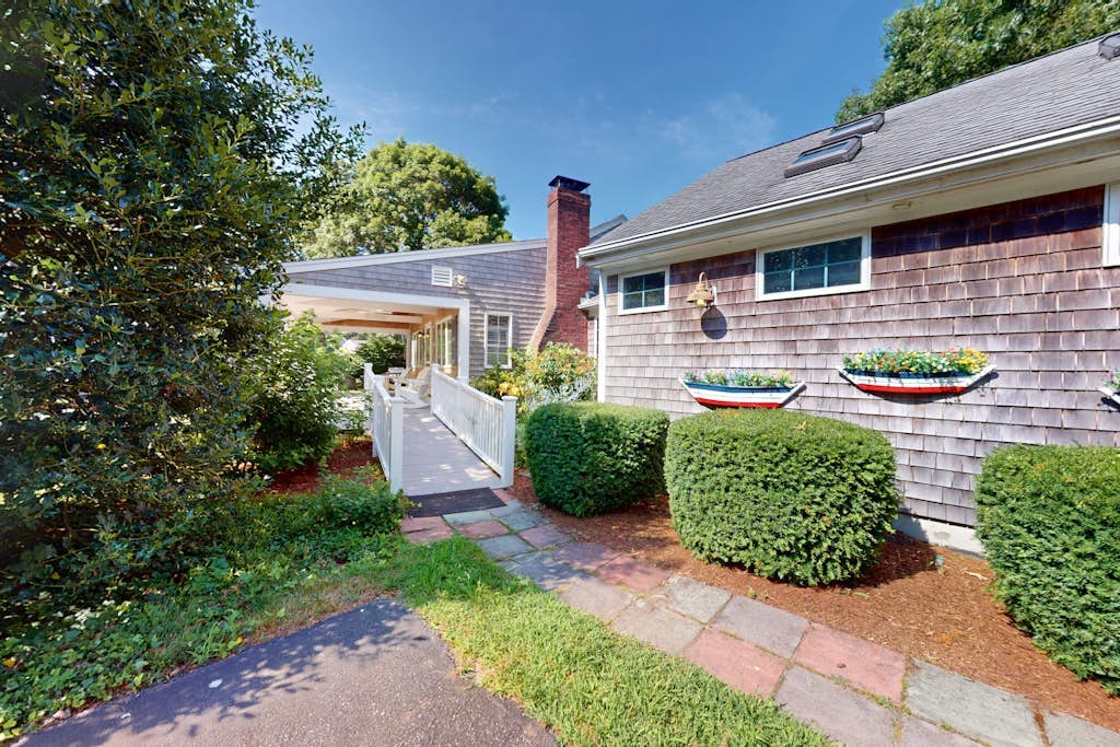 Tree-lined home with lovely yard, decks & private beach access - walk to town