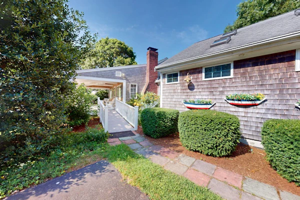 Tree-lined home with lovely yard, decks & private beach access - walk to town