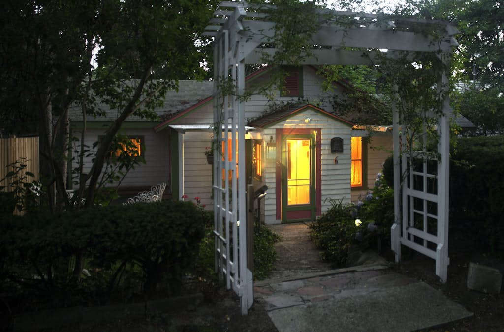 Historic cottage with patio, games, walk to beach & dog-friendly fenced yard