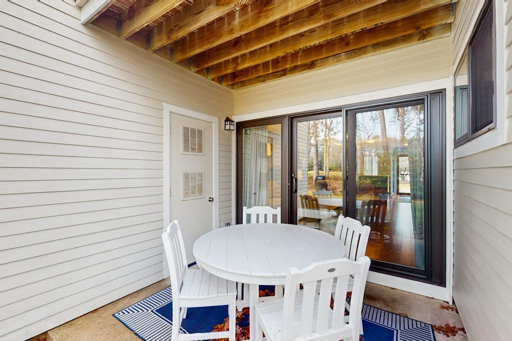 Modern fairway condo with open layout, private patio, AC & washer/dryer