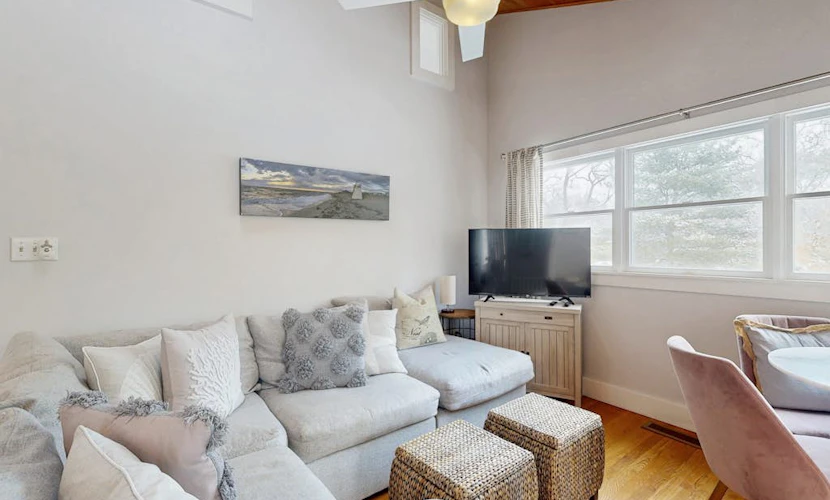 Stylish island retreat with sunny interiors, wraparound deck, firepit & AC