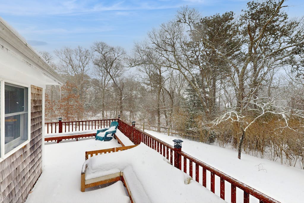 Stylish island retreat with sunny interiors, wraparound deck, firepit & AC