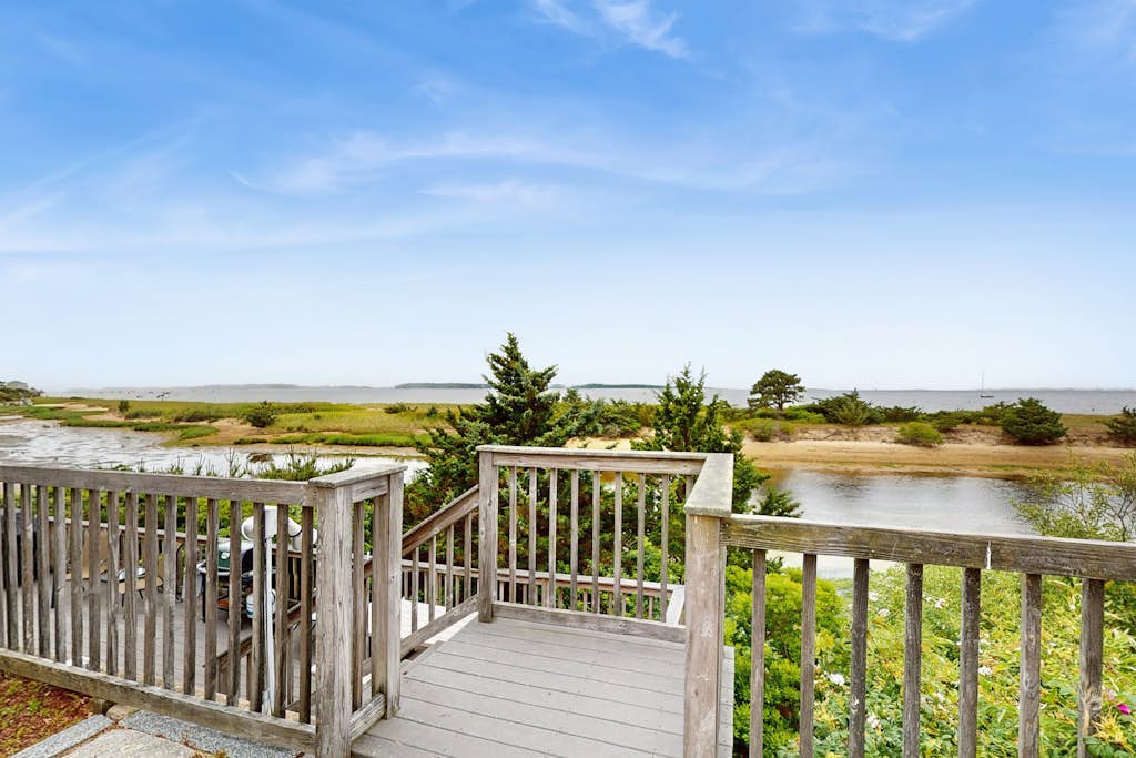 Quintessential coastal studio with beach access, BBQ area, patio, & water views