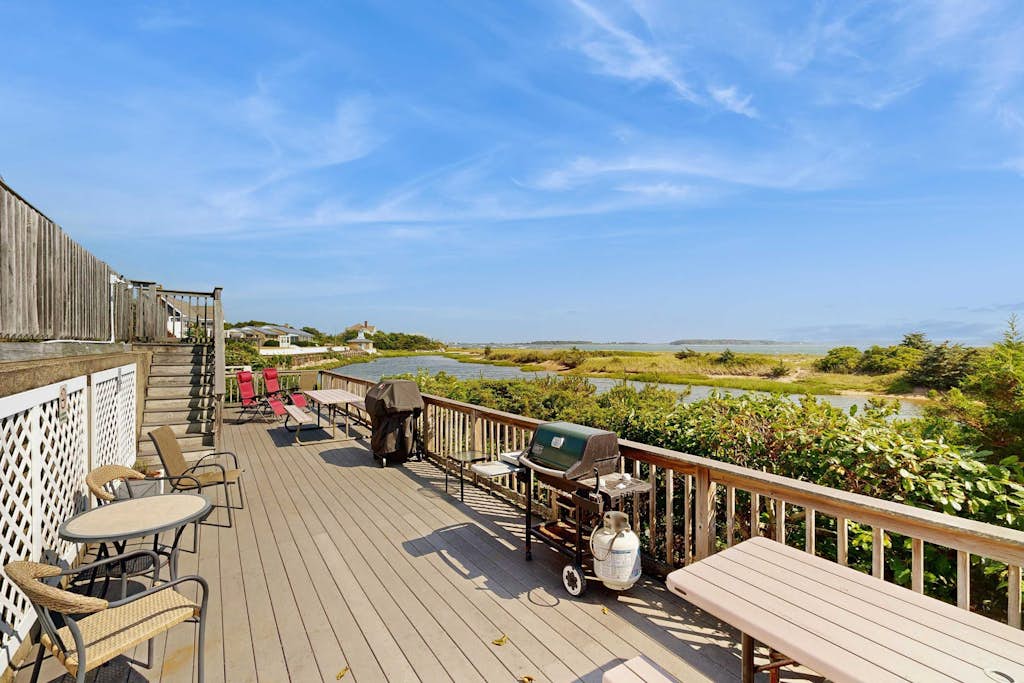 Quintessential coastal studio with beach access, BBQ area, patio, & water views