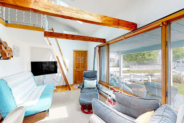 Seaside condo with patio, beach access, loft, board games, gas grill, & firepit