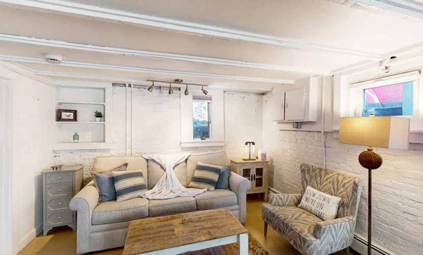 Modern & bright condo with patio, W/D, and central location near town & beach