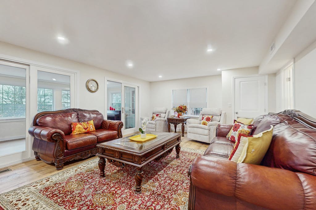 Pondfront escape with private beach, hot tub, sauna, play area & dog-friendly